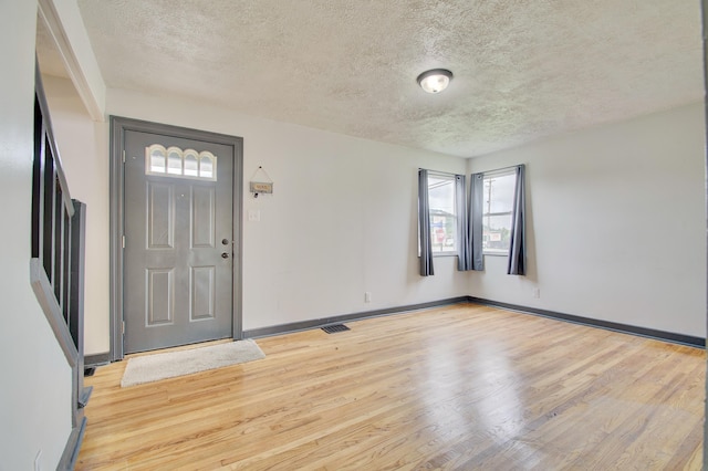 2 Doris Dr, Latonia, KY 41015 - entrance foyer with light wood-style flooring and a textured ceiling