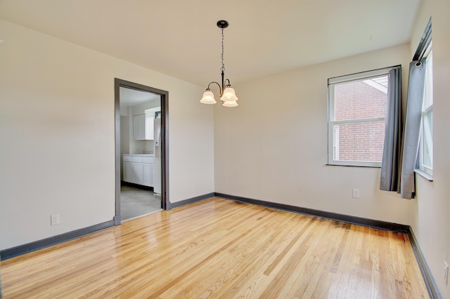 2 Doris Dr, Latonia, KY 41015 - spare room with wood finished floors and a chandelier