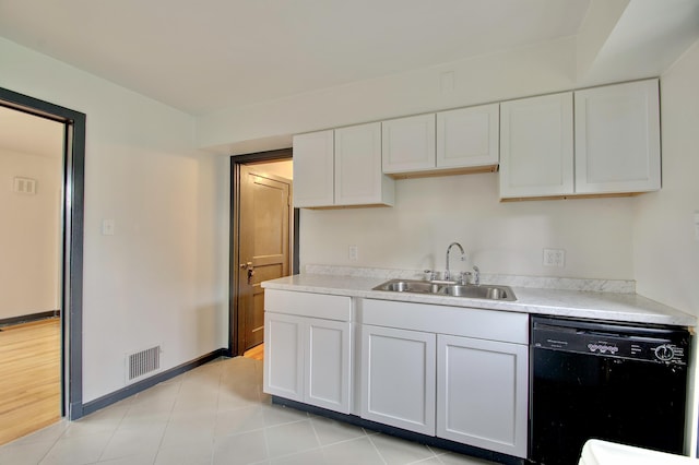 2 Doris Dr, Latonia, KY 41015 - kitchen with black dishwasher, white cabinetry, light countertops, and light tile patterned floors