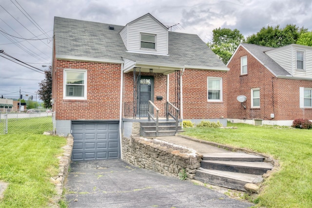 2 Doris Dr, Latonia, KY 41015 - cape cod-style house with a garage, asphalt driveway, brick siding, and a shingled roof