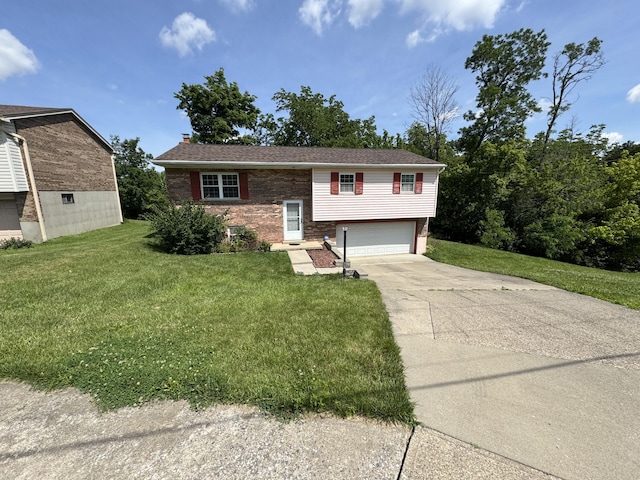 4120 Taylor Ct, Erlanger, KY 41018 - raised ranch featuring driveway, a garage, a front lawn, and brick siding