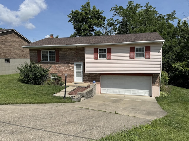 4120 Taylor Ct, Erlanger, KY 41018 - bi-level home with an attached garage, concrete driveway, brick siding, and a front yard