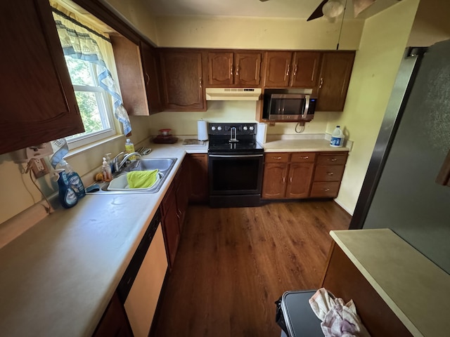 4120 Taylor Ct, Erlanger, KY 41018 - kitchen featuring black electric range, under cabinet range hood, stainless steel microwave, light countertops, and dark wood finished floors