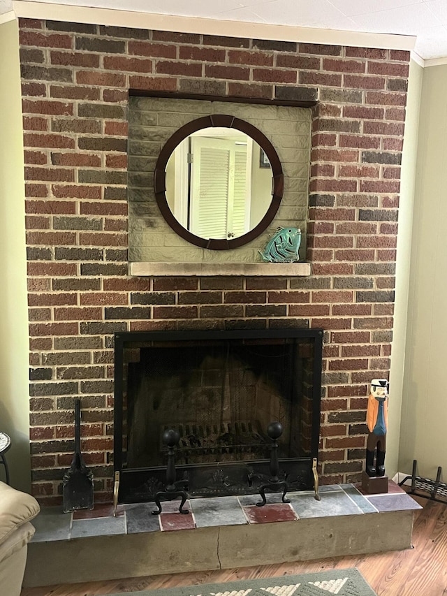 567 Rose Bourne Ln, Owenton, KY 40359 - detailed view of a brick fireplace, wood finished floors, and crown molding