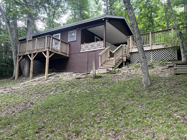 567 Rose Bourne Ln, Owenton, KY 40359 - view of home's exterior featuring a deck, concrete block siding, and stairway