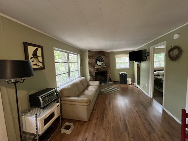 567 Rose Bourne Ln, Owenton, KY 40359 - living room with wood finished floors, a brick fireplace, and crown molding