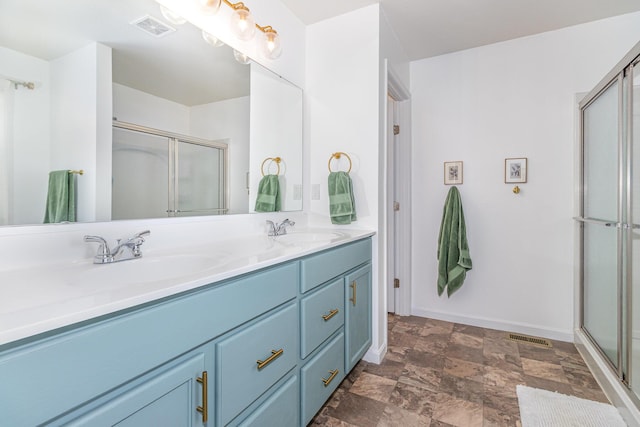 6638 Glencree Ln, Union, KY 41091 - full bath featuring double vanity, a stall shower, and stone finish floors