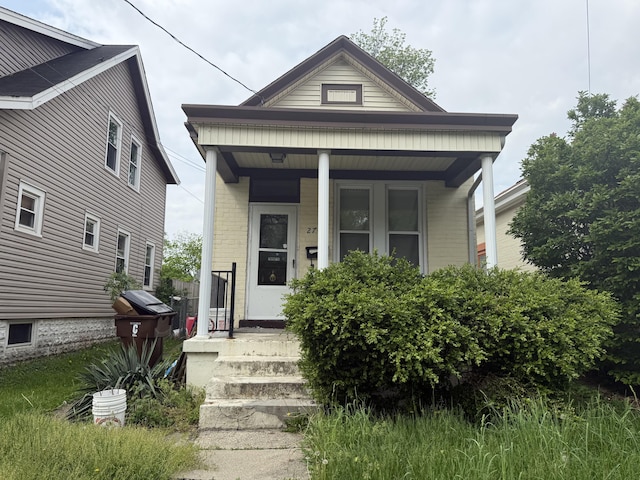 2749 Alexandria Ave, Covington, KY 41015 - view of front of house featuring a porch and brick siding