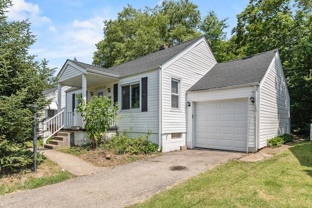 112 Valley Dr, Florence, KY 41042 - ranch-style home with a shingled roof, driveway, a garage, and a chimney