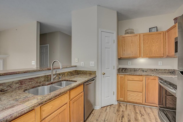 150 Saddlebrook Ln Unit 535, Florence, KY 41042 - kitchen featuring stainless steel appliances, light wood-style flooring, and light stone counters