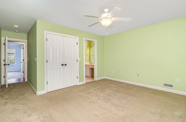 543 Karlenia Ct, Edgewood, KY 41017 - unfurnished bedroom featuring light carpet, a closet, connected bathroom, and ceiling fan