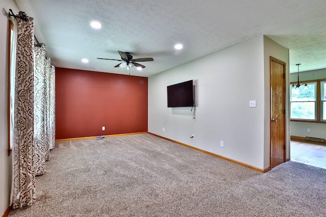 1710 Hilltop Dr, Carrollton, KY 41008 - unfurnished living room with carpet, a ceiling fan, a textured ceiling, and recessed lighting