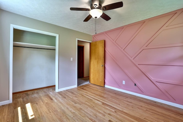 1710 Hilltop Dr, Carrollton, KY 41008 - unfurnished bedroom featuring light wood-style floors, a closet, and ceiling fan