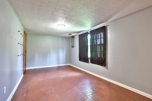 1710 Hilltop Dr, Carrollton, KY 41008 - unfurnished room with brick patterned flooring, a textured ceiling, and electric panel