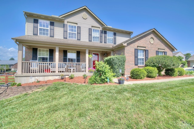 1025 Wakefield Ct, Hebron, KY 41048 - view of front of property with brick siding, a porch, and a front yard