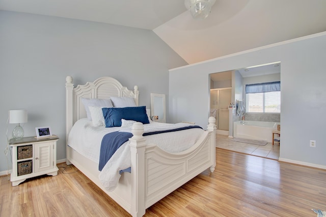 1025 Wakefield Ct, Hebron, KY 41048 - bedroom featuring light wood-type flooring, vaulted ceiling, and ensuite bath