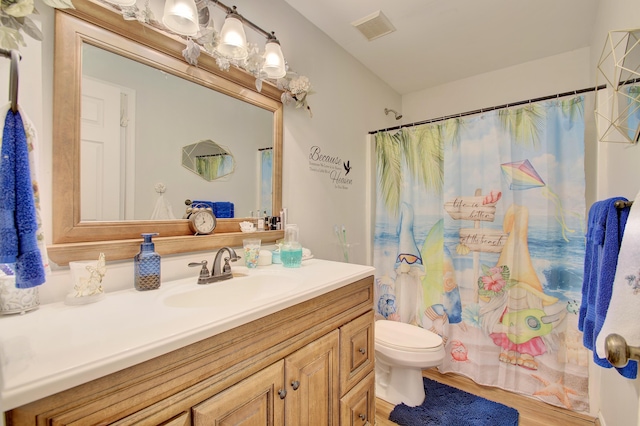 1025 Wakefield Ct, Hebron, KY 41048 - bathroom featuring vanity, wood finished floors, and curtained shower
