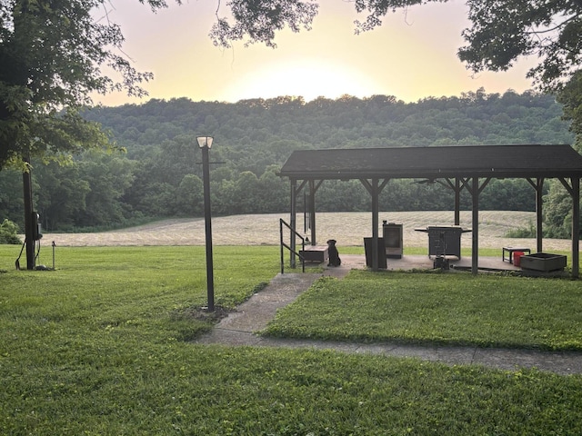 604 Rifle Range Rd, Alexandria, KY 41001 - surrounding community with a lawn and a wooded view