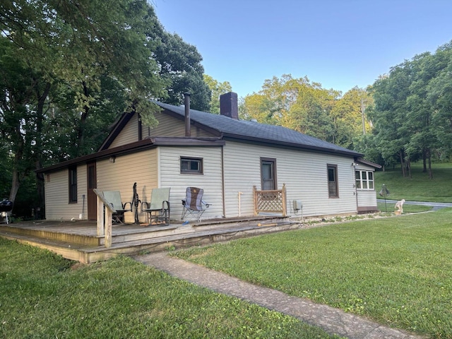 604 Rifle Range Rd, Alexandria, KY 41001 - back of property featuring a chimney, a wooden deck, and a lawn