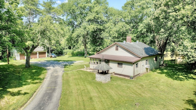 604 Rifle Range Rd, Alexandria, KY 41001 - view of home's exterior featuring an outbuilding, a yard, and asphalt driveway