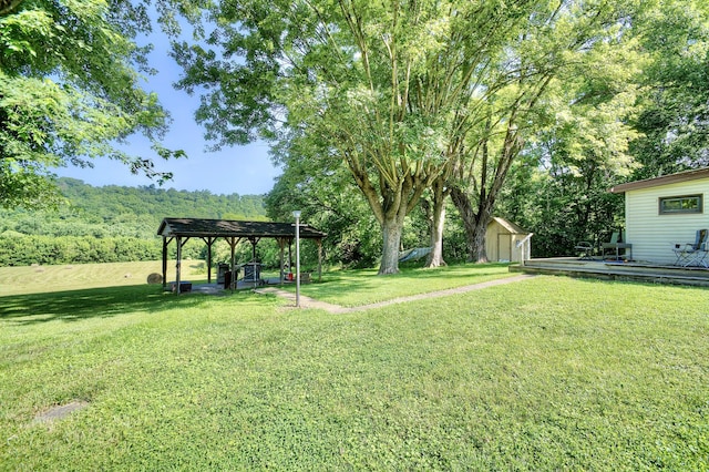 604 Rifle Range Rd, Alexandria, KY 41001 - view of grassy yard featuring a storage shed, a pergola, and a deck