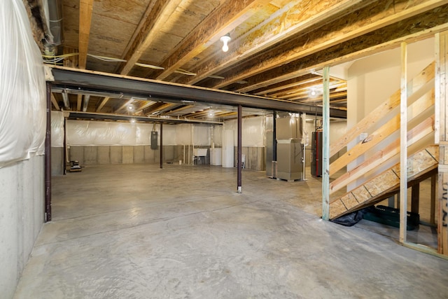 3020 Toulouse Dr, Union, KY 41091 - unfinished basement featuring heating unit, stairway, and gas water heater