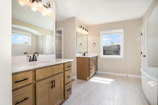 3020 Toulouse Dr, Union, KY 41091 - full bathroom with two vanities and a freestanding tub