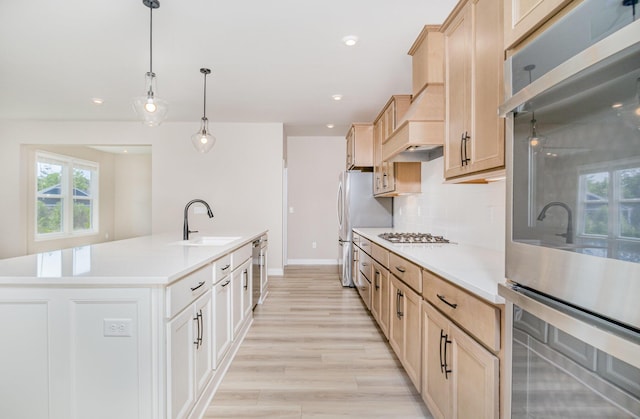 3020 Toulouse Dr, Union, KY 41091 - kitchen featuring stainless steel appliances, a kitchen island with sink, light countertops, backsplash, and recessed lighting