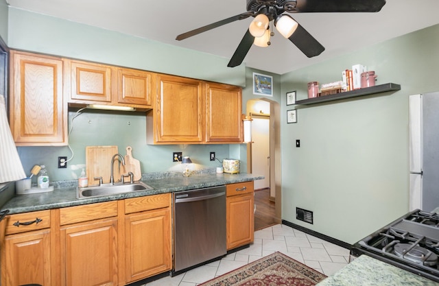 305 Helen St, Ludlow, KY 41016 - kitchen with stainless steel dishwasher, a ceiling fan, stove, light tile patterned flooring, and dark countertops