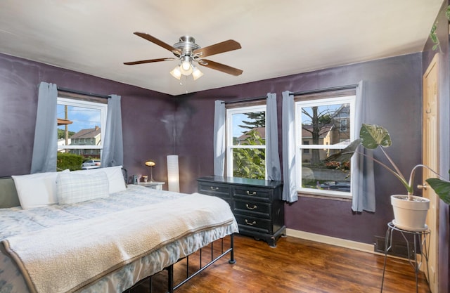 305 Helen St, Ludlow, KY 41016 - bedroom featuring multiple windows, dark wood-type flooring, and ceiling fan