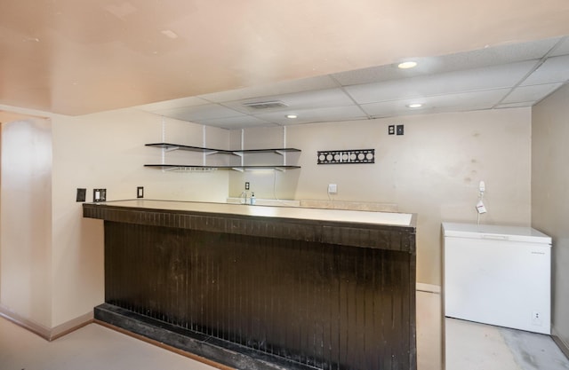 305 Helen St, Ludlow, KY 41016 - indoor wet bar featuring fridge, a paneled ceiling, concrete floors, and recessed lighting