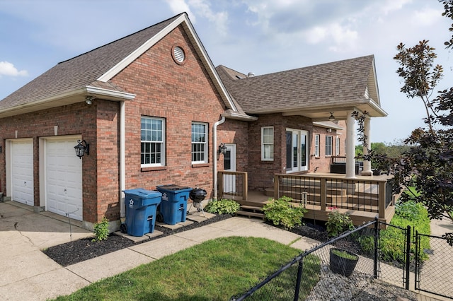 103 Mohawk Trl, Dry Ridge, KY 41035 - view of front of house featuring a shingled roof, brick siding, french doors, and a wooden deck