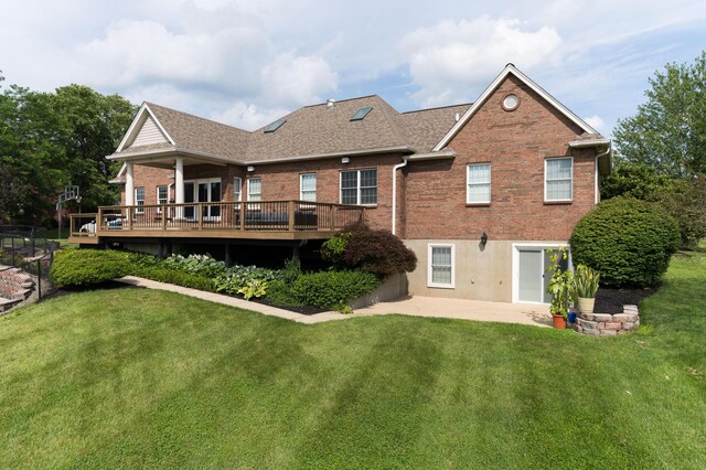 103 Mohawk Trl, Dry Ridge, KY 41035 - rear view of property with brick siding, a deck, a lawn, and a patio