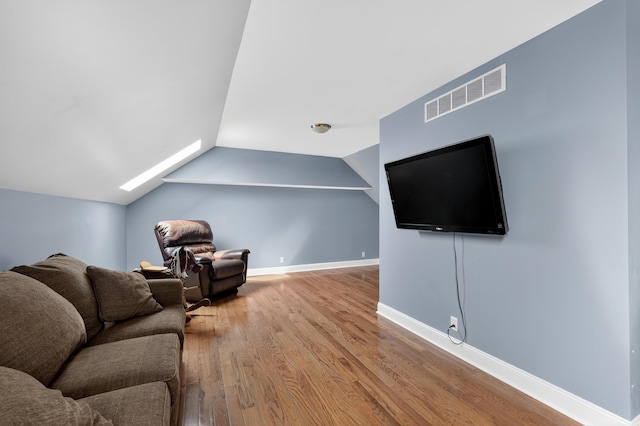 103 Mohawk Trl, Dry Ridge, KY 41035 - living room featuring wood finished floors, vaulted ceiling, and a skylight