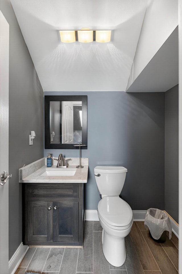 103 Mohawk Trl, Dry Ridge, KY 41035 - half bath featuring wood finish floors, vanity, and lofted ceiling
