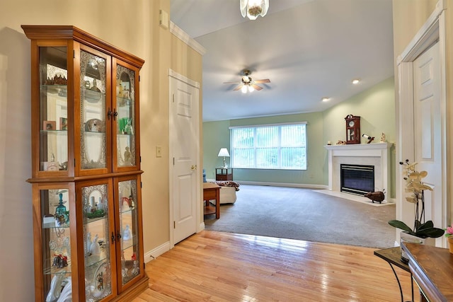6315 Baymiller Ln, Burlington, KY 41005 - entryway featuring ceiling fan, a fireplace with flush hearth, and light wood-style floors