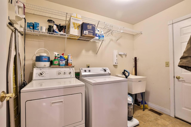 6315 Baymiller Ln, Burlington, KY 41005 - washroom featuring washing machine and clothes dryer and light tile patterned floors
