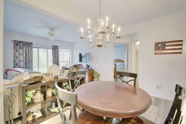 7305 Centrecrest Ln Unit G, Florence, KY 41042 - dining room with wood finished floors, a ceiling fan, and a chandelier