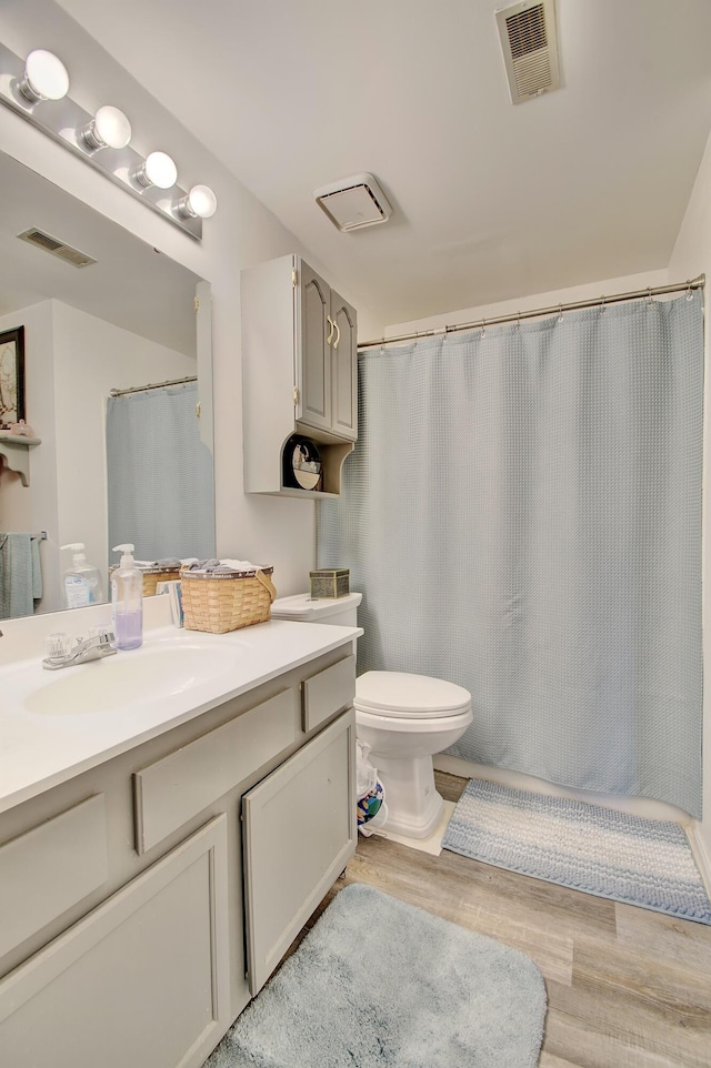 7305 Centrecrest Ln Unit G, Florence, KY 41042 - full bathroom with vanity, wood finished floors, and a shower with shower curtain