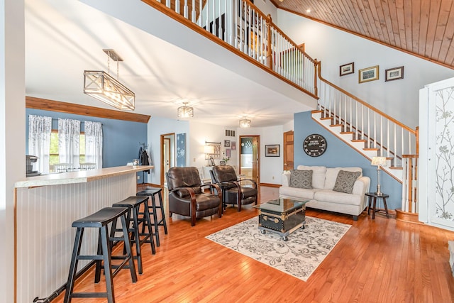 9500 Lower River Rd, Burlington, KY 41005 - living room with light wood-style flooring, stairs, wooden ceiling, and high vaulted ceiling