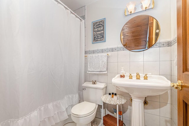 9500 Lower River Rd, Burlington, KY 41005 - full bath with tile walls, wainscoting, and a shower with shower curtain