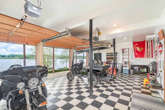 9500 Lower River Rd, Burlington, KY 41005 - garage featuring a garage door opener and a water view