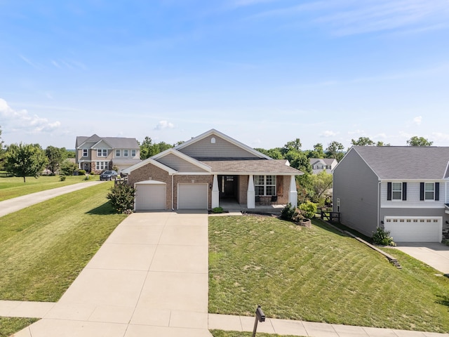2373 Frontier Dr, Hebron, KY 41048 - craftsman inspired home featuring driveway, a front lawn, brick siding, and a porch