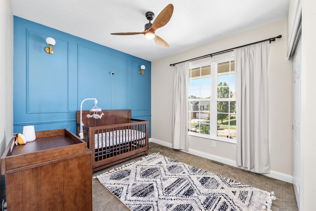 2373 Frontier Dr, Hebron, KY 41048 - carpeted bedroom with a crib and a ceiling fan