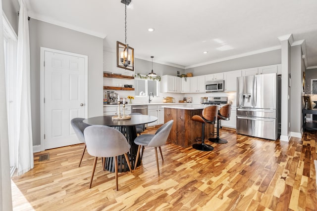 2373 Frontier Dr, Hebron, KY 41048 - dining space with ornamental molding, recessed lighting, and light wood-style flooring
