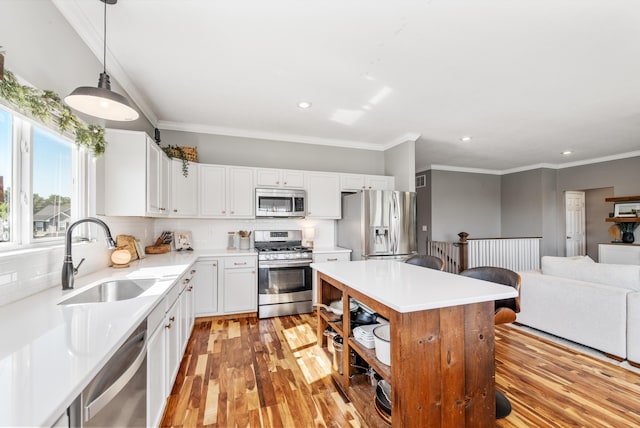 2373 Frontier Dr, Hebron, KY 41048 - kitchen with stainless steel appliances, recessed lighting, crown molding, tasteful backsplash, and light wood-style floors