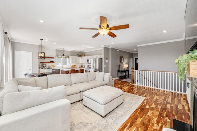 2373 Frontier Dr, Hebron, KY 41048 - living room featuring wood finished floors, ceiling fan, recessed lighting, and ornamental molding