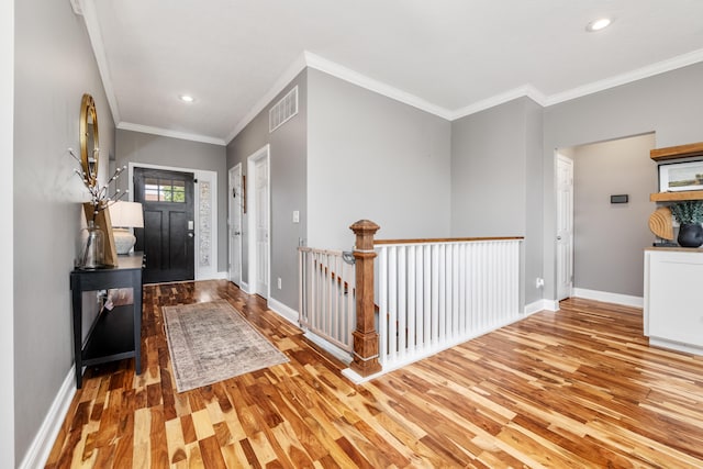 2373 Frontier Dr, Hebron, KY 41048 - entryway with light wood-style flooring, ornamental molding, and recessed lighting