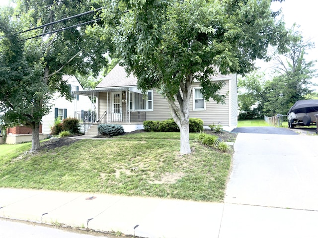 13 Drexel Ave, Florence, KY 41042 - view of front facade with covered porch, a front yard, asphalt driveway, and a shingled roof