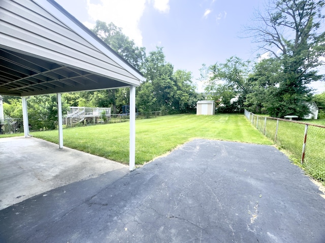 13 Drexel Ave, Florence, KY 41042 - fenced backyard with a patio area and a storage unit